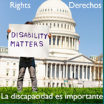 Person holding Disability Matters sign